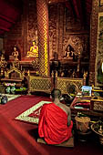 Chiang Mai - The Wat Phra Singh temple. The small Viharn Lai Kham (Gilded Hall), the interiors are  decorated with brocade-like gold and red pattern. 